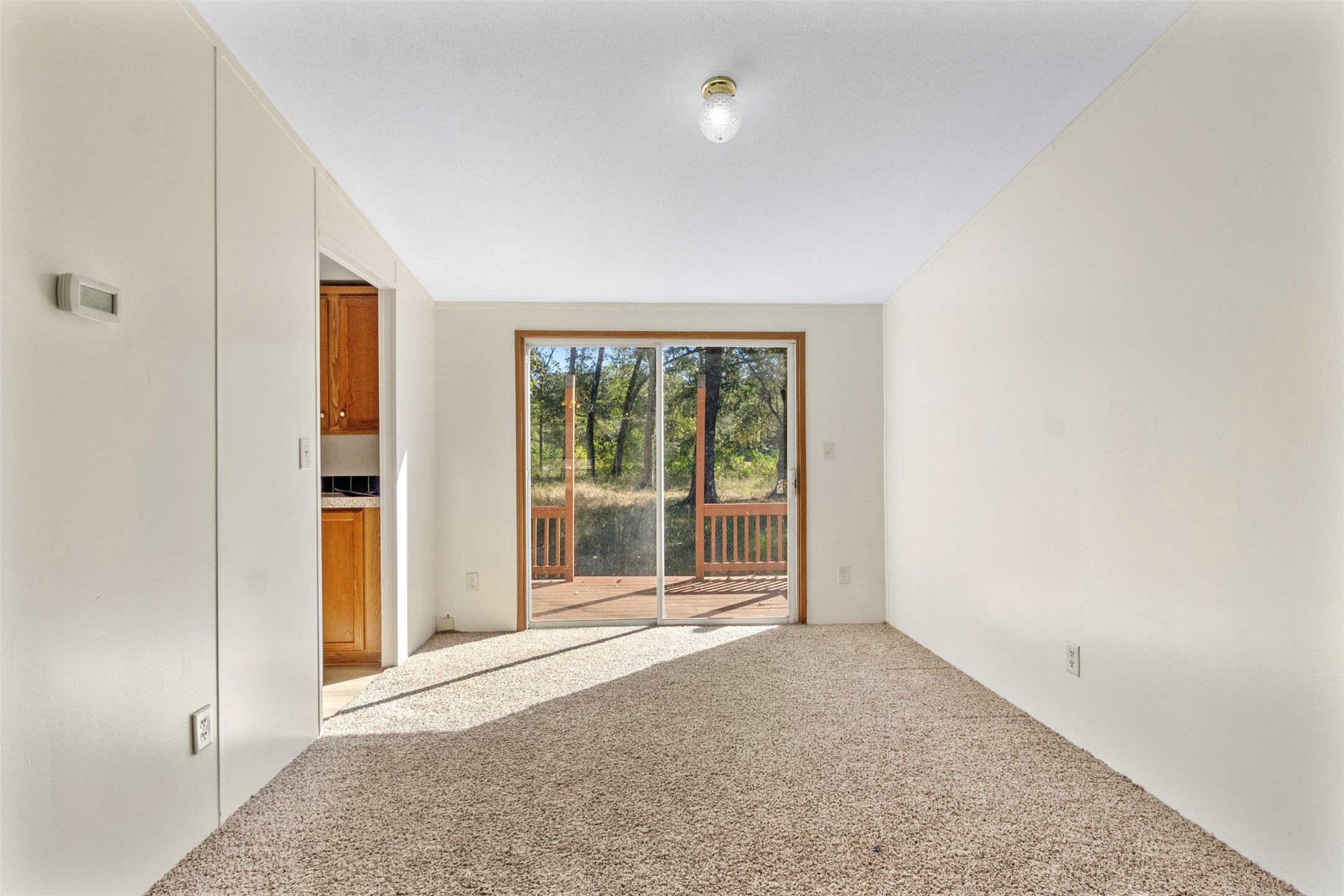 27182 East River Road Splendora, TX 77372 - Photo 22 of 40 an empty room with windows and entrance