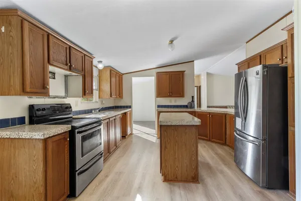 an empty room with windows and entrance