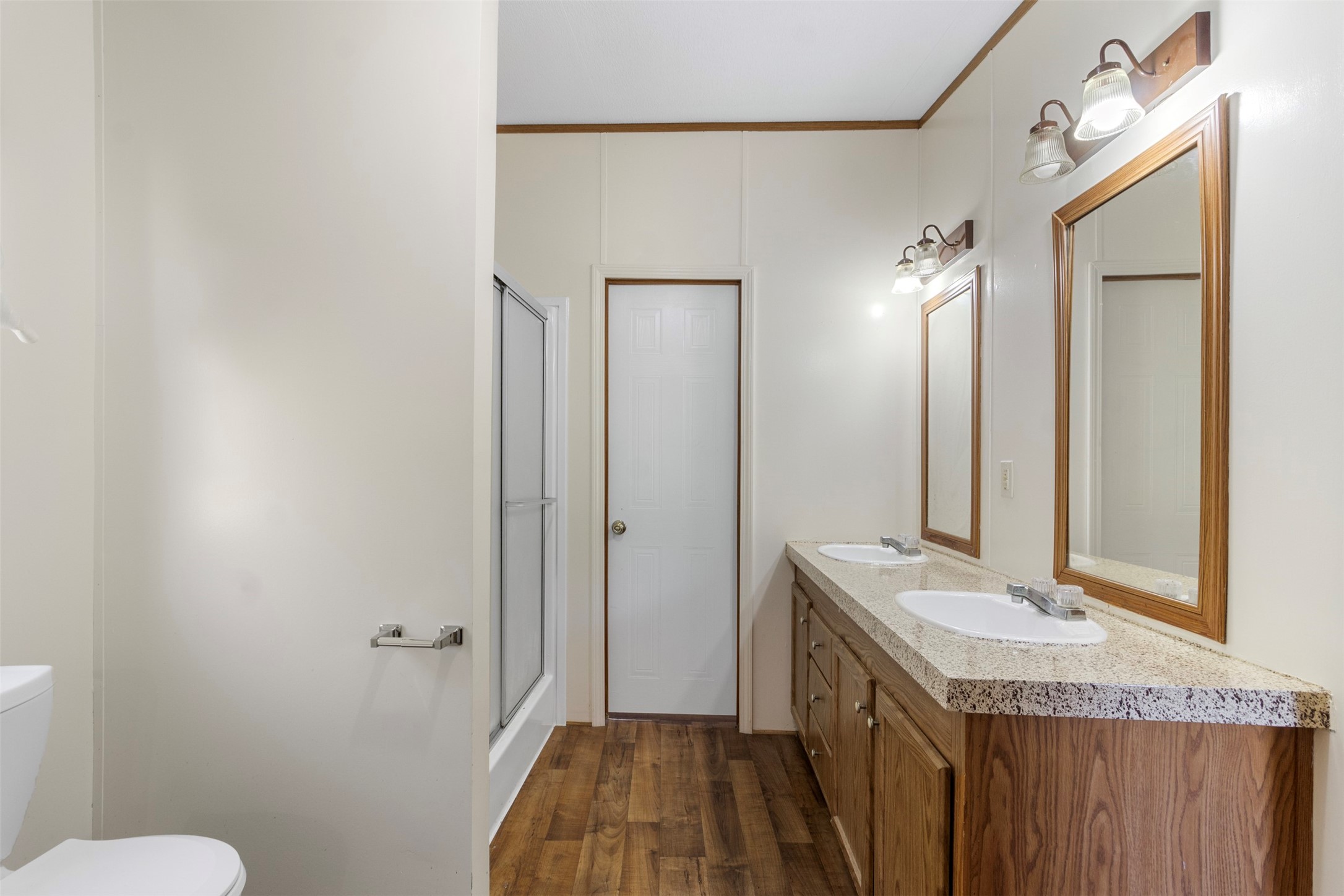 27182 East River Road Splendora, TX 77372 - Photo 29 of 40 a bathroom with a granite countertop sink and a mirror