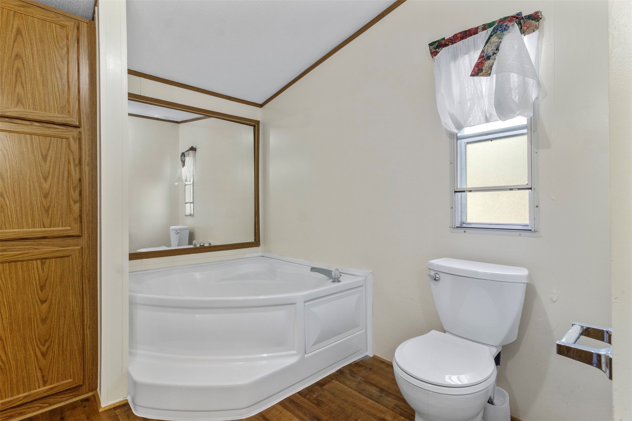 27182 East River Road Splendora, TX 77372 - Photo 30 of 40 a bathroom with a toilet and a mirror
