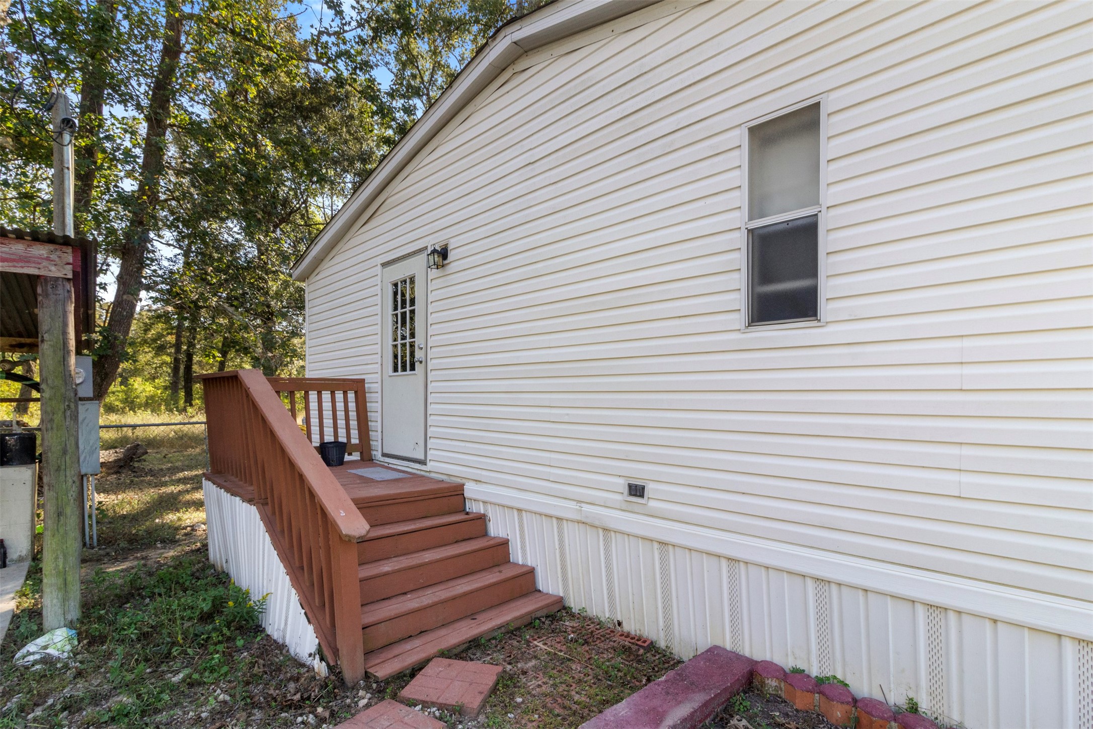 27182 East River Road Splendora, TX 77372 - Photo 31 of 40 a view of a house with wooden deck