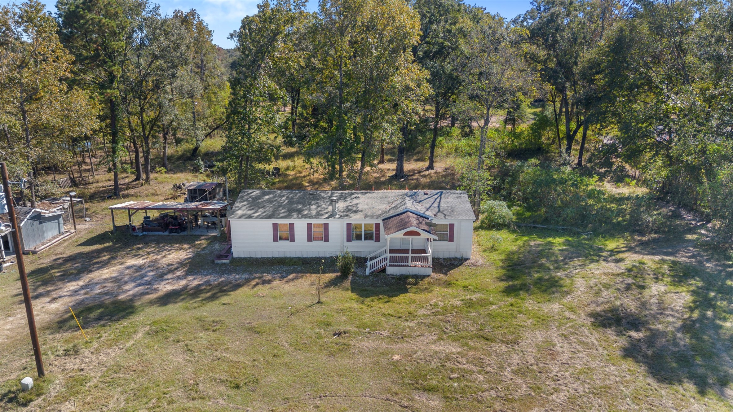 27182 East River Road Splendora, TX 77372 - Photo 34 of 40 a view of a house with a yard