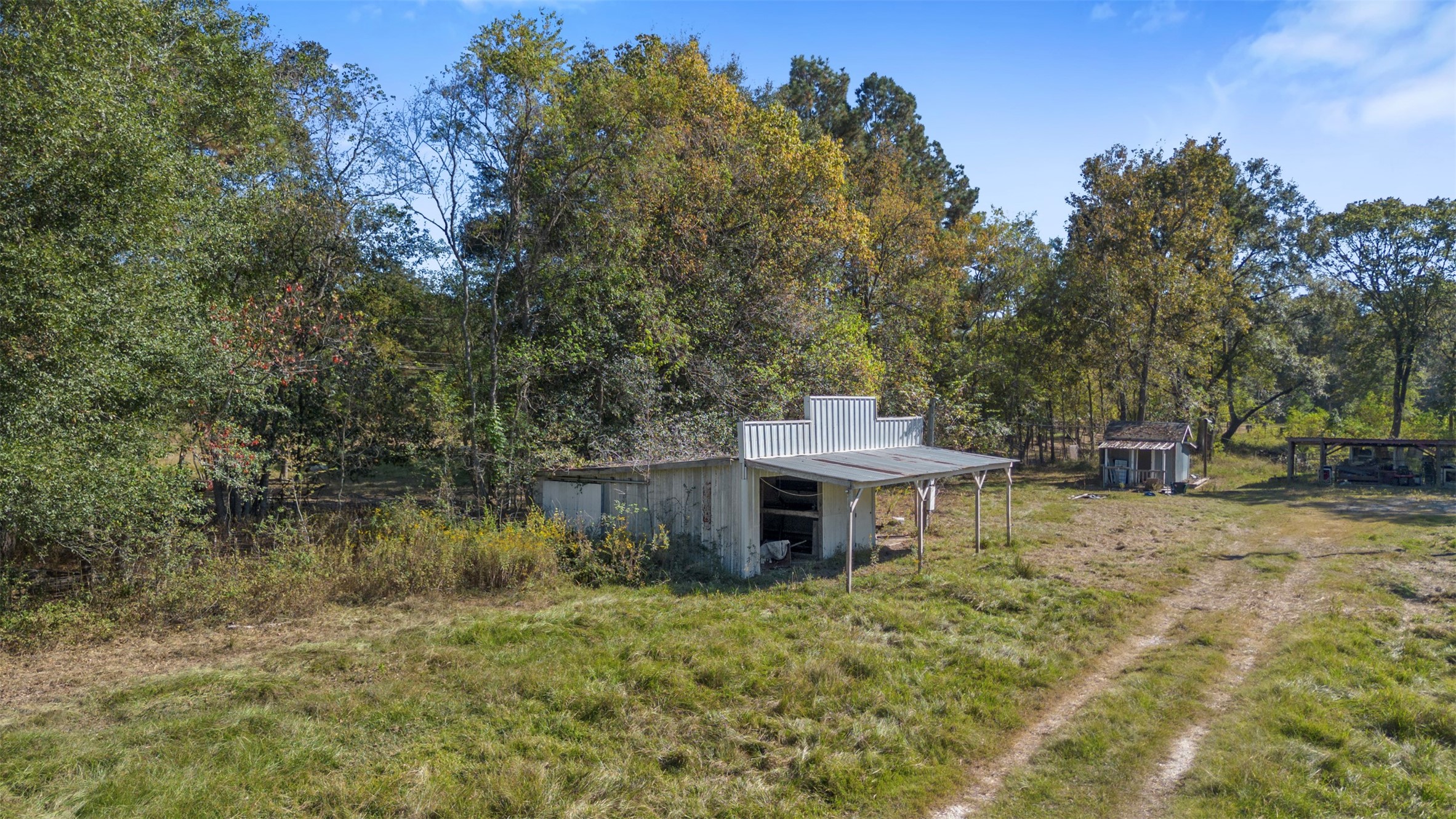 27182 East River Road Splendora, TX 77372 - Photo 38 of 40 a view of a house with a yard