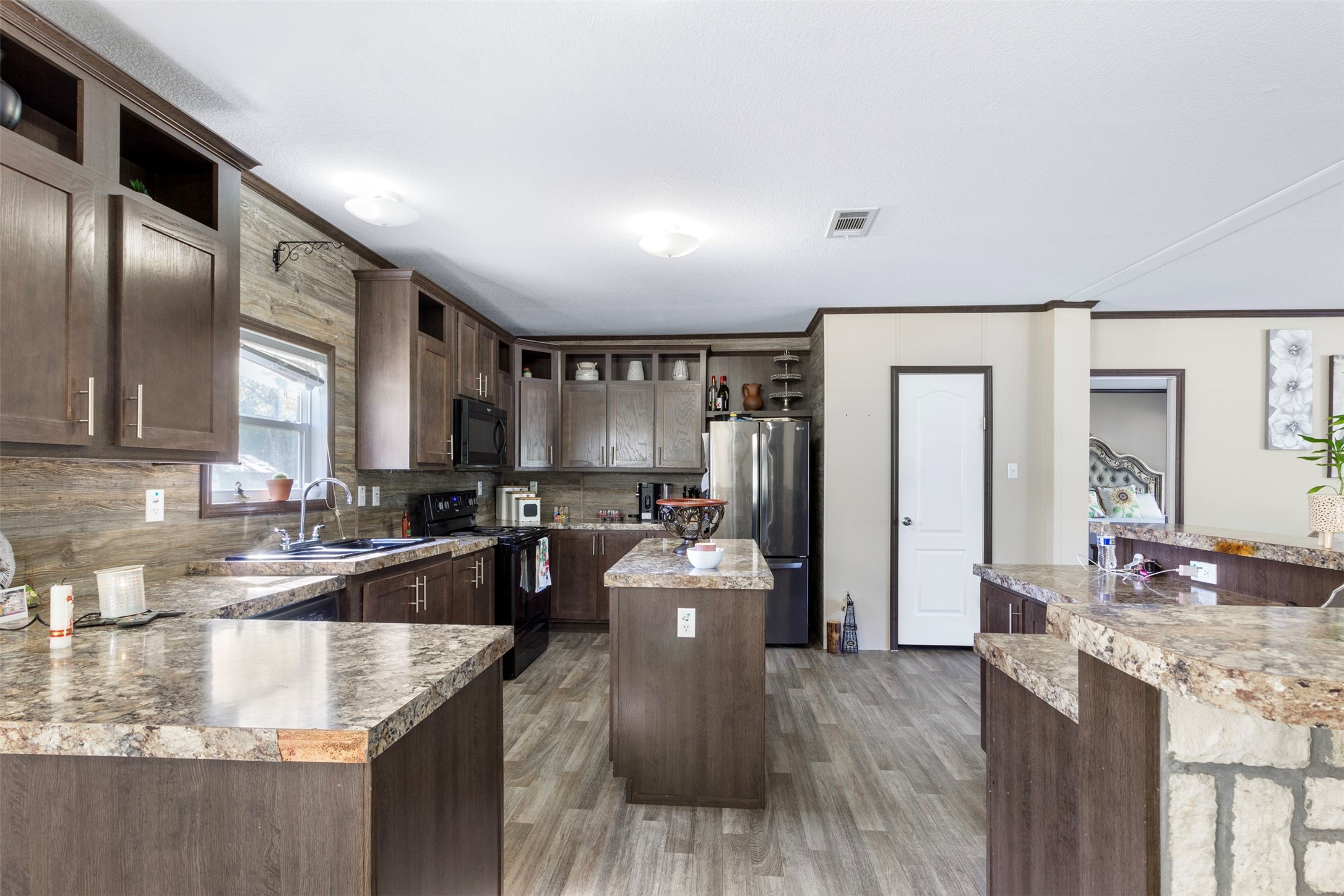 27182 East River Road Splendora, TX 77372 - Photo 6 of 40 a large kitchen with granite countertop lots of counter top space