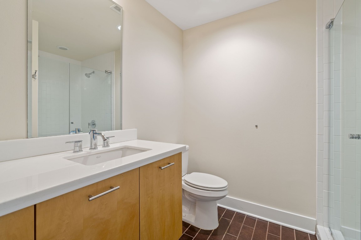 603 Davis Street, Unit 1304 Austin, TX 78701 - Photo 14 of 40 a bathroom with a sink and a toilet