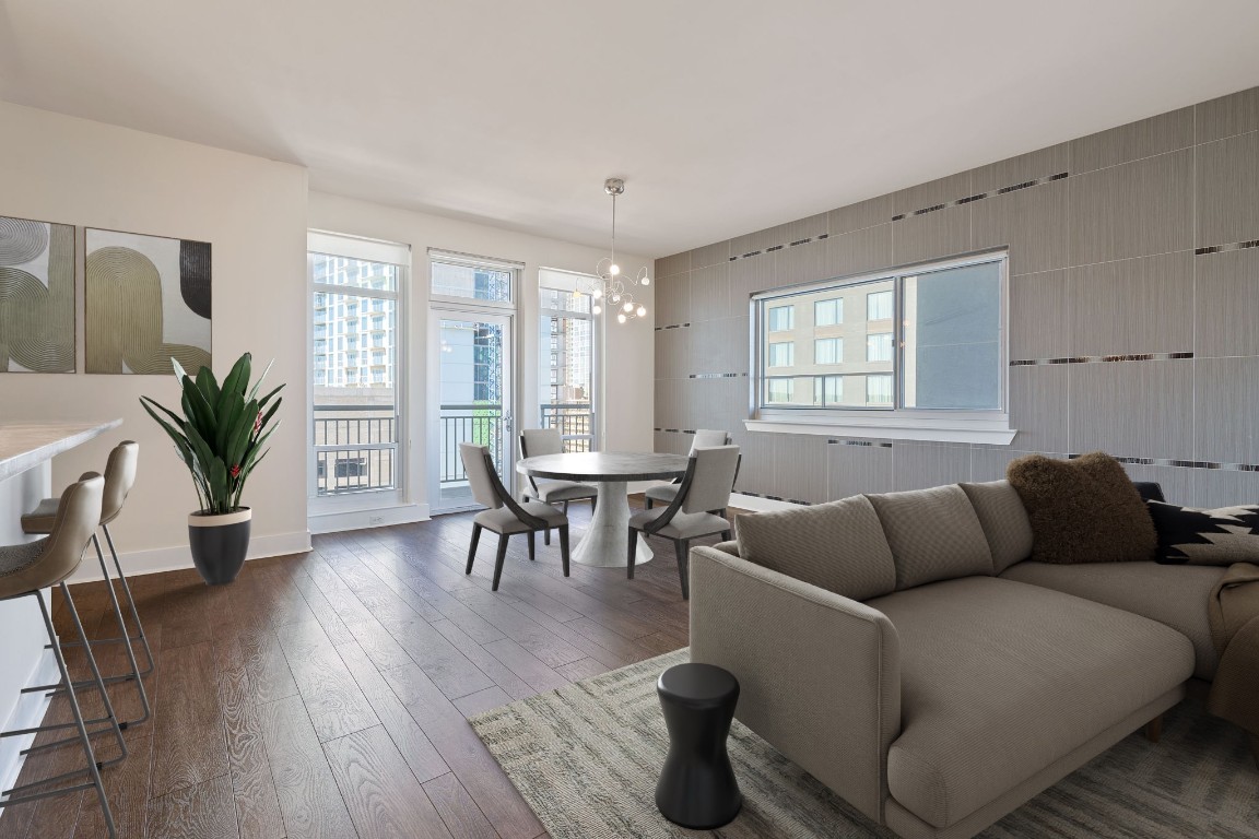 603 Davis Street, Unit 1304 Austin, TX 78701 - Photo 2 of 40 a living room with furniture and a potted plant