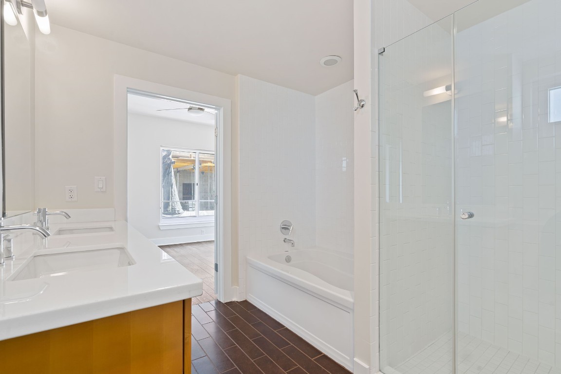 603 Davis Street, Unit 1304 Austin, TX 78701 - Photo 21 of 40 a bathroom with a tub sink and mirror