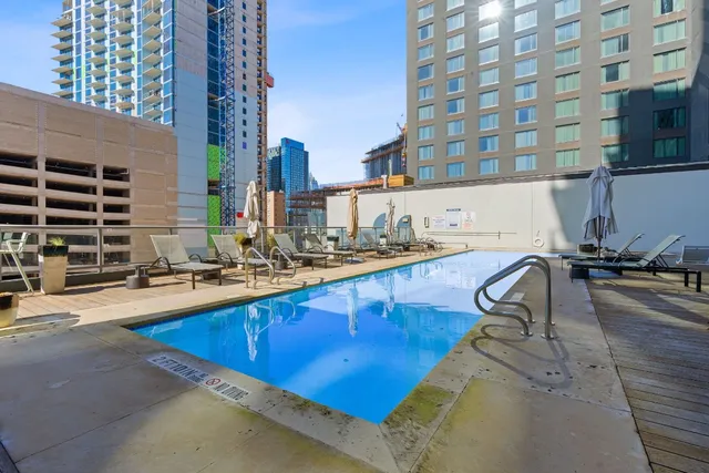 a view of a swimming pool with chairs