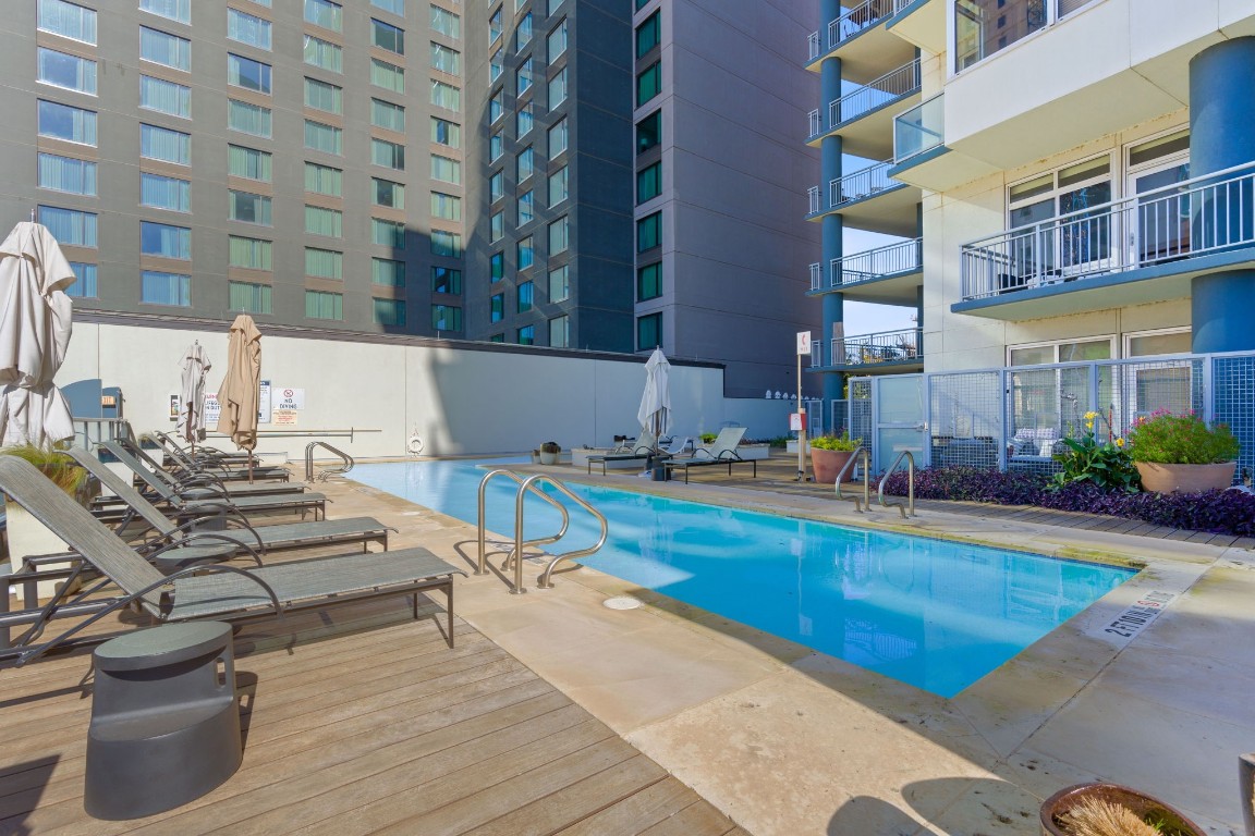 603 Davis Street, Unit 1304 Austin, TX 78701 - Photo 35 of 40 a view of a swimming pool and lounge chairs