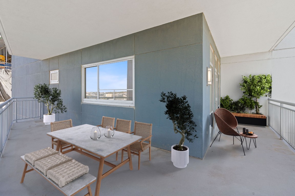 603 Davis Street, Unit 1304 Austin, TX 78701 - Photo 6 of 40 a living room with furniture potted plant and a window