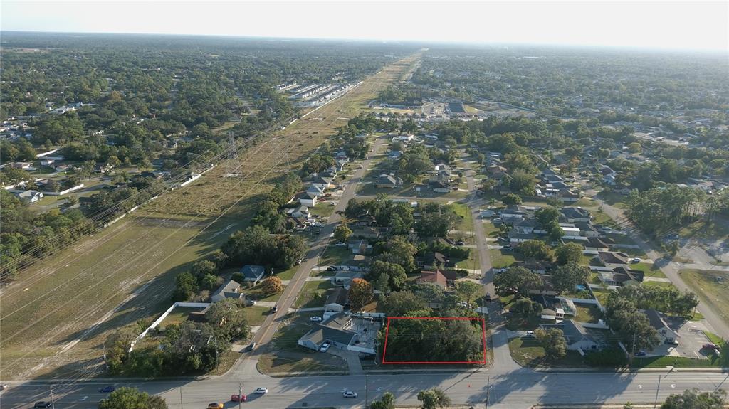 11290 Spring Hill Drive Spring Hill, FL 34609 - Photo 13 of 15 an aerial view of house with yard and mountain view in back