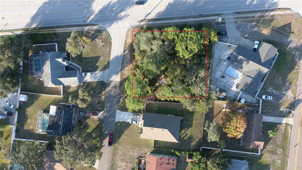 11290 Spring Hill Drive Spring Hill, FL 34609 - Photo 7 of 15 an aerial view of a house with a yard and garden
