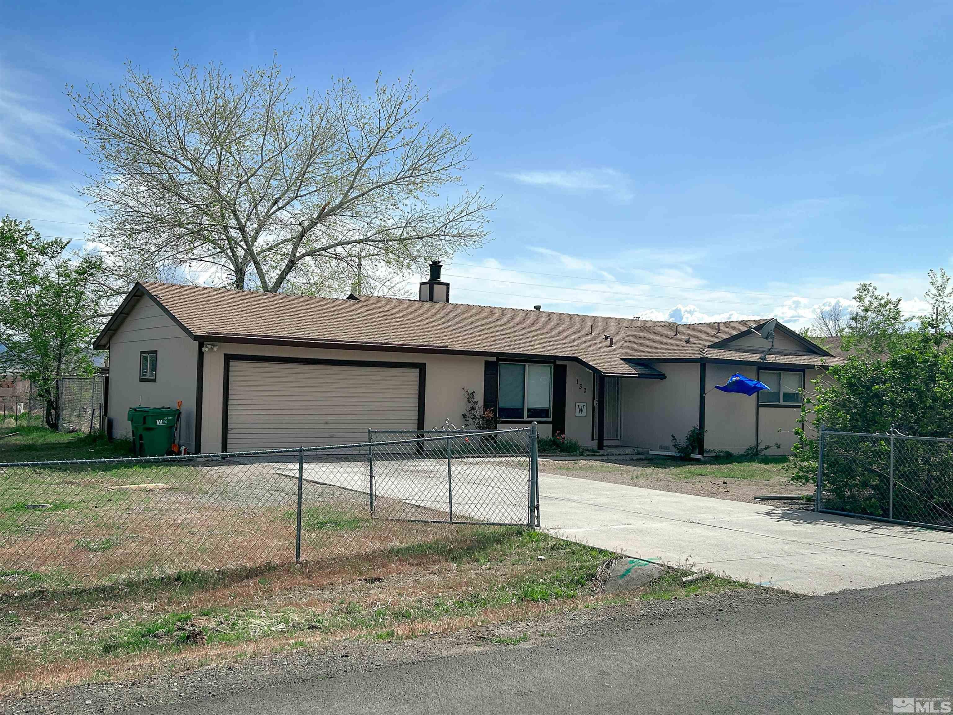 130 Ring Road Dayton, NV 89403 - Photo 1 of 21 a house that has a tree in front of it