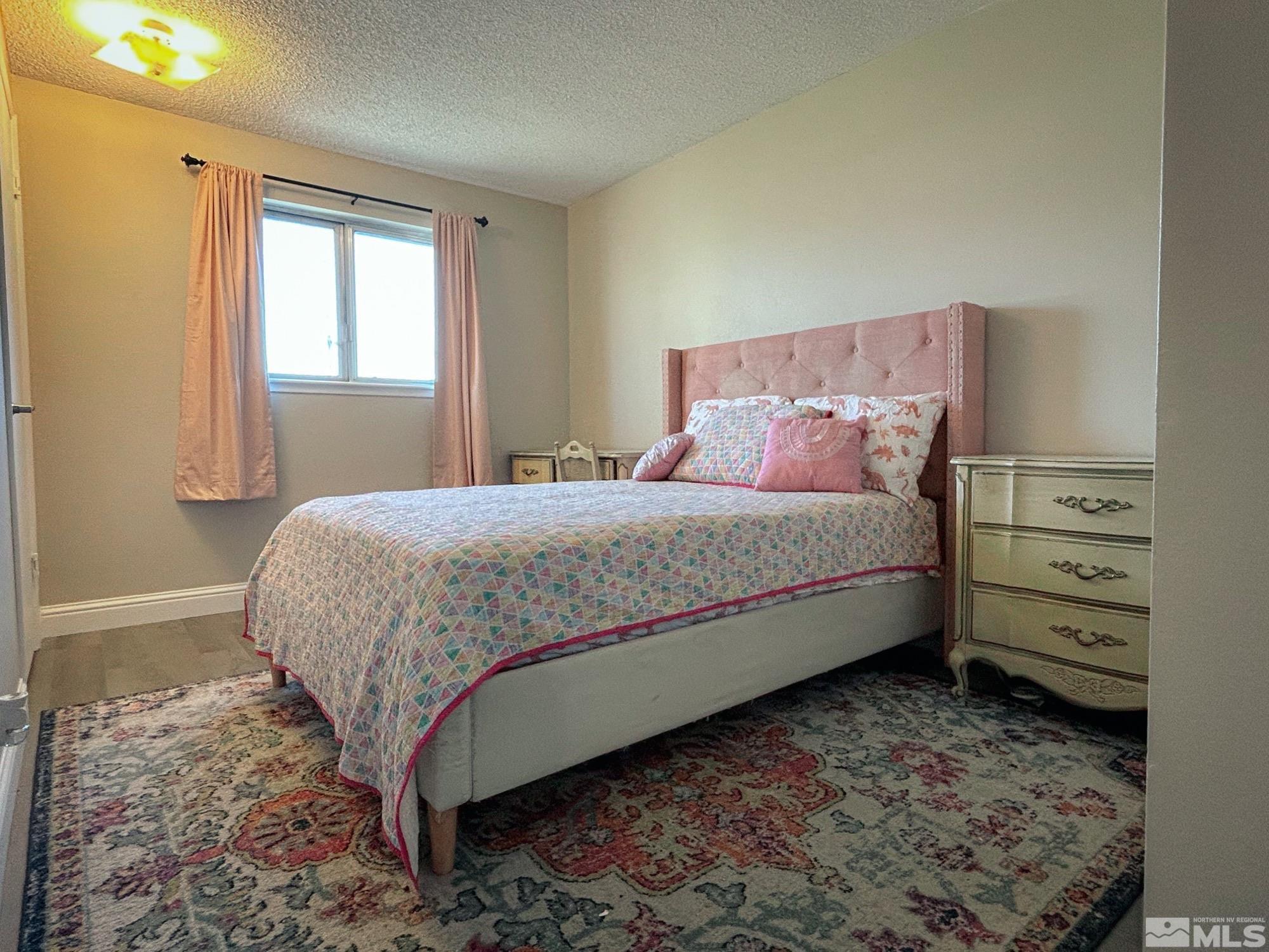 130 Ring Road Dayton, NV 89403 - Photo 11 of 21 a bedroom with a bed and a window