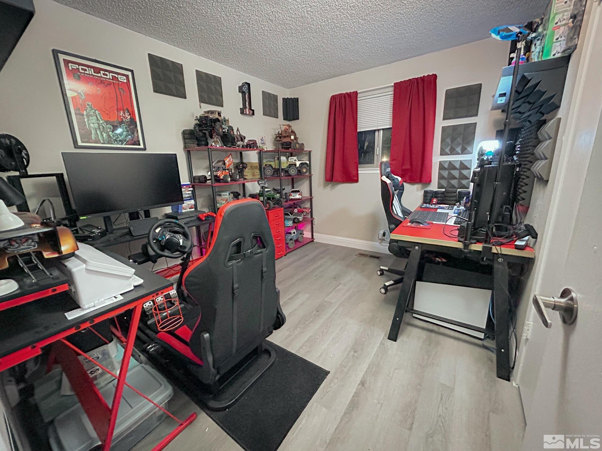 130 Ring Road Dayton, NV 89403 - Photo 12 of 21 a room with gym equipment and a flat screen tv