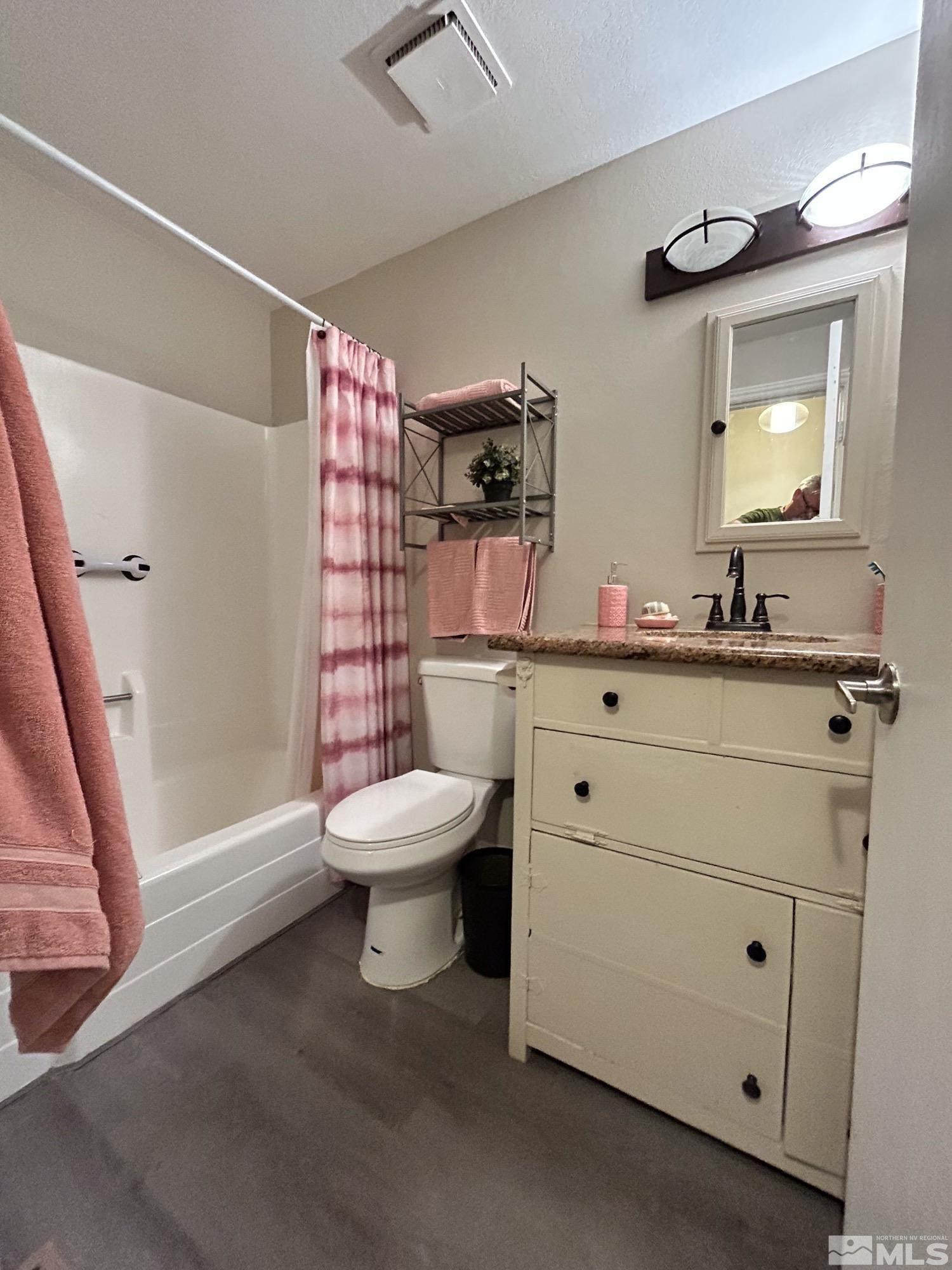 130 Ring Road Dayton, NV 89403 - Photo 15 of 21 a bathroom with a sink a toilet and shower