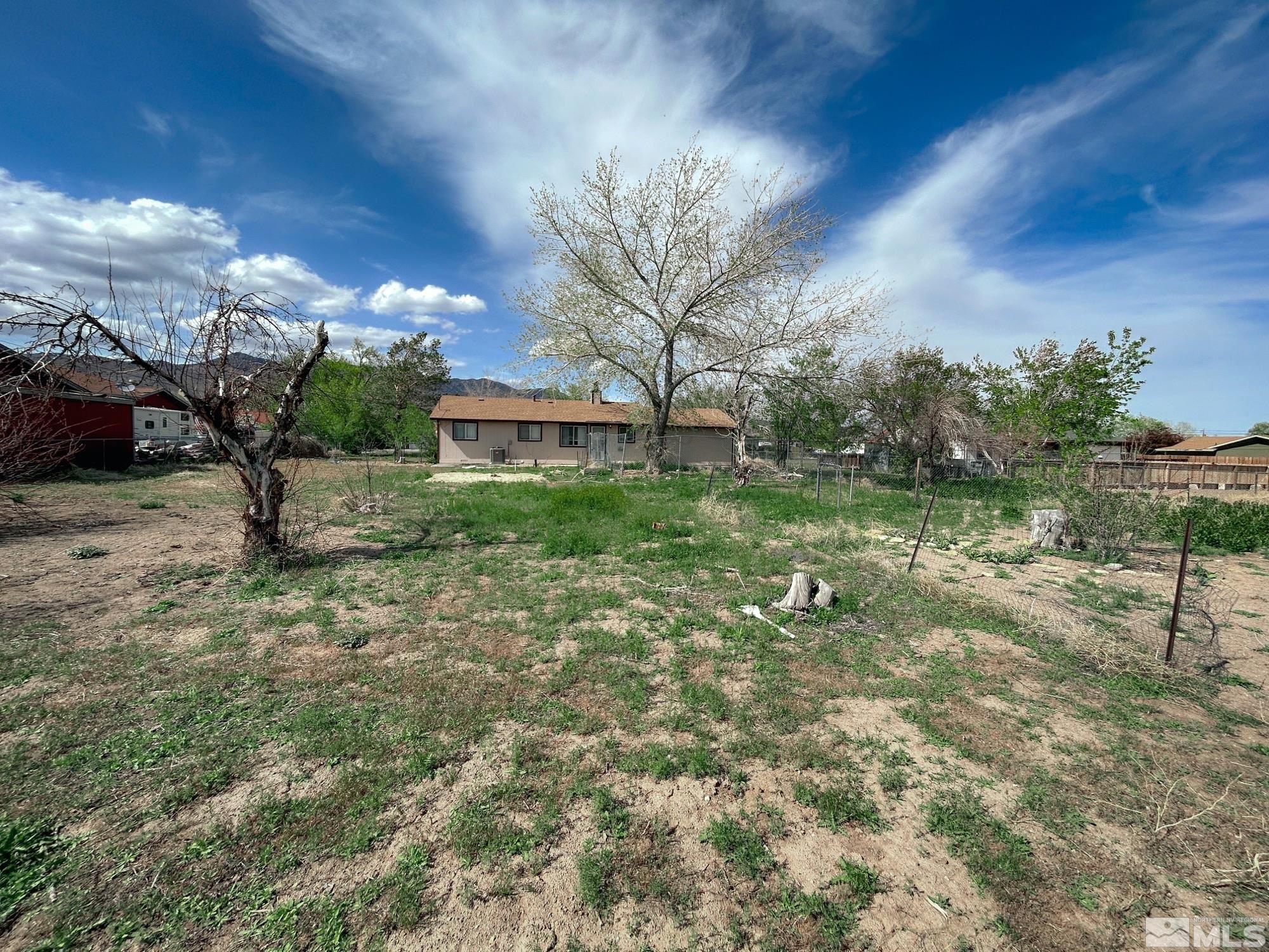 130 Ring Road Dayton, NV 89403 - Photo 20 of 21 a view of a yard with plants and a bench