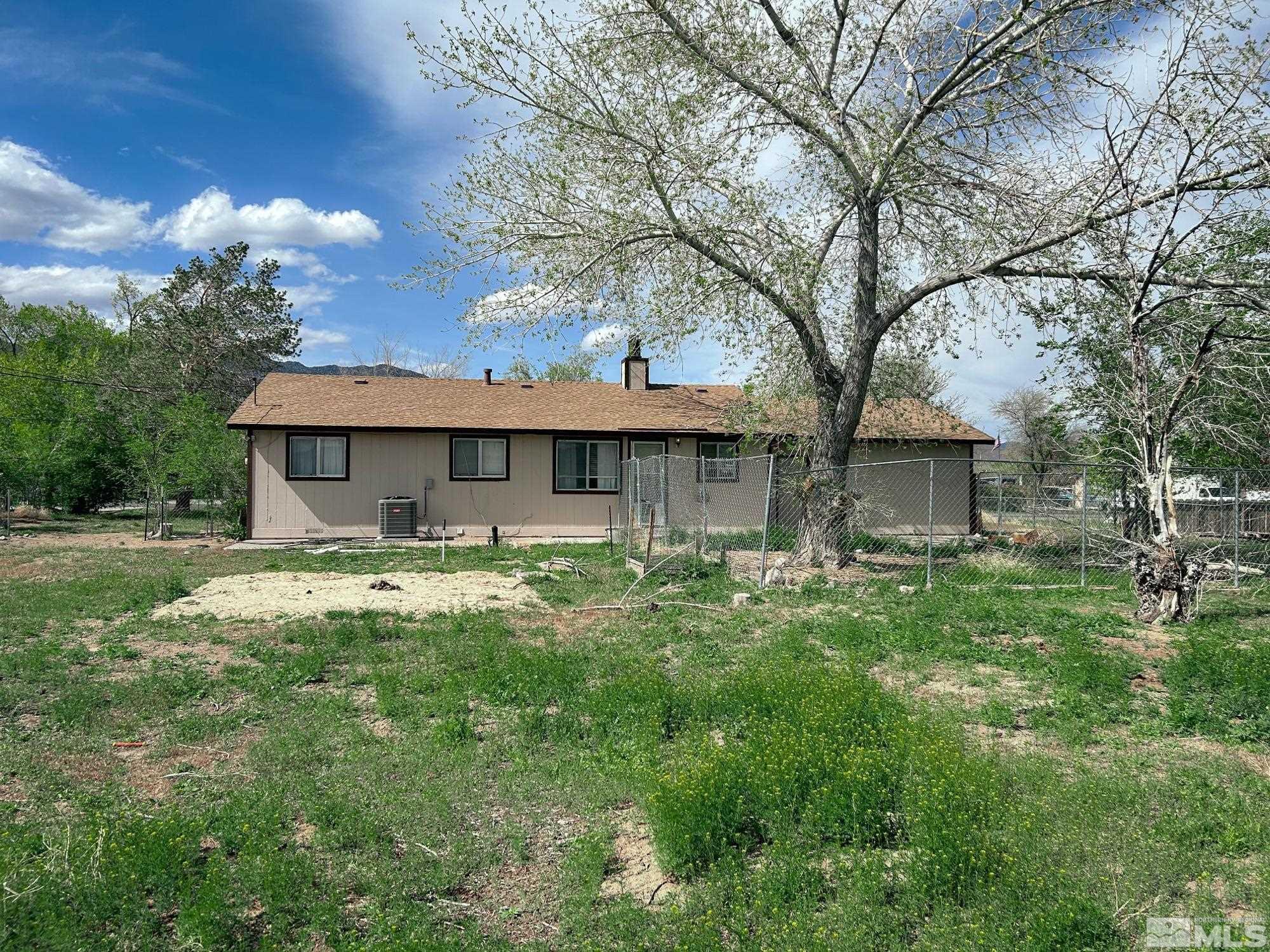 130 Ring Road Dayton, NV 89403 - Photo 21 of 21 a front view of a house with a garden