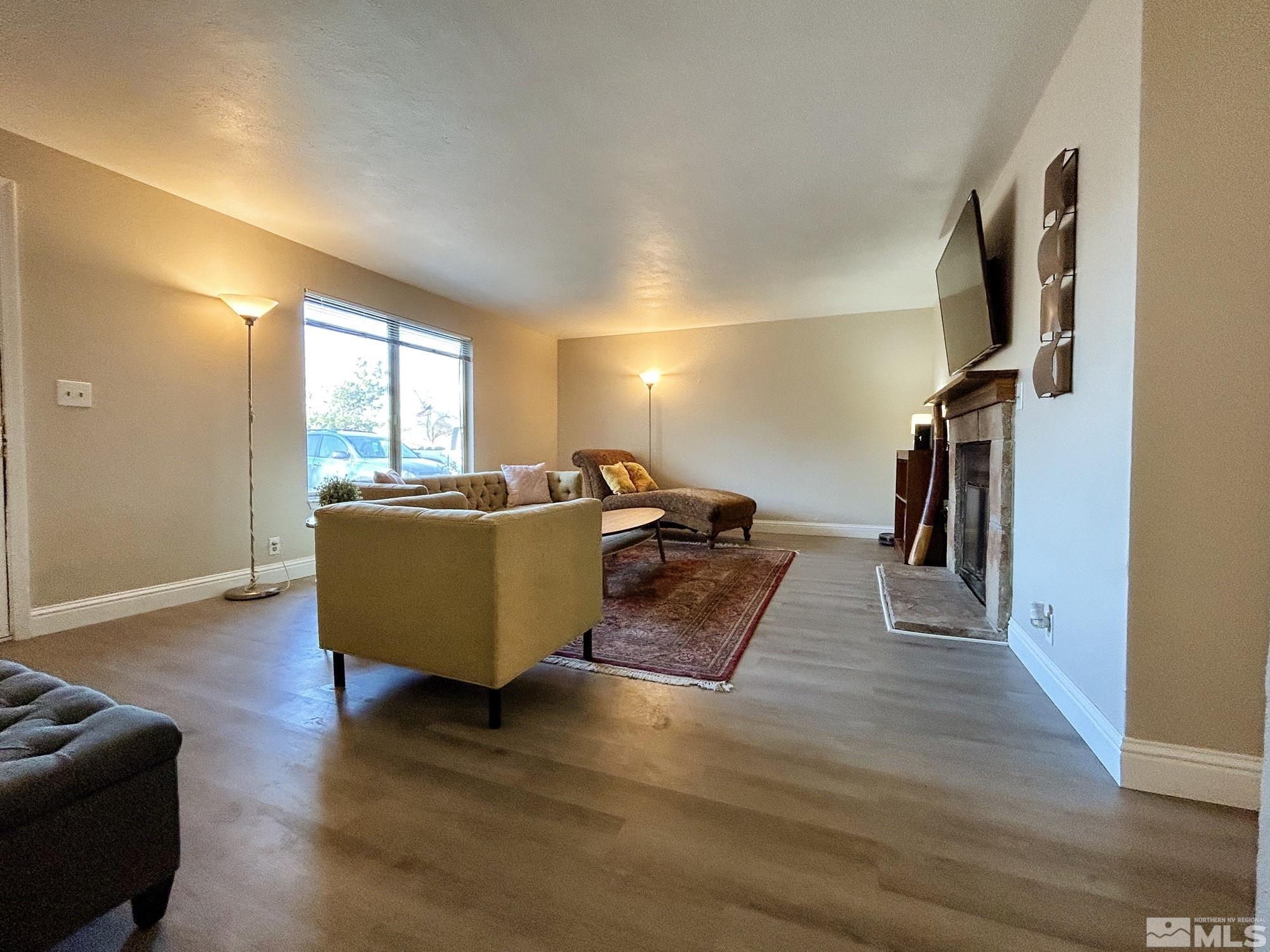 130 Ring Road Dayton, NV 89403 - Photo 5 of 21 a living room with furniture and a flat screen tv