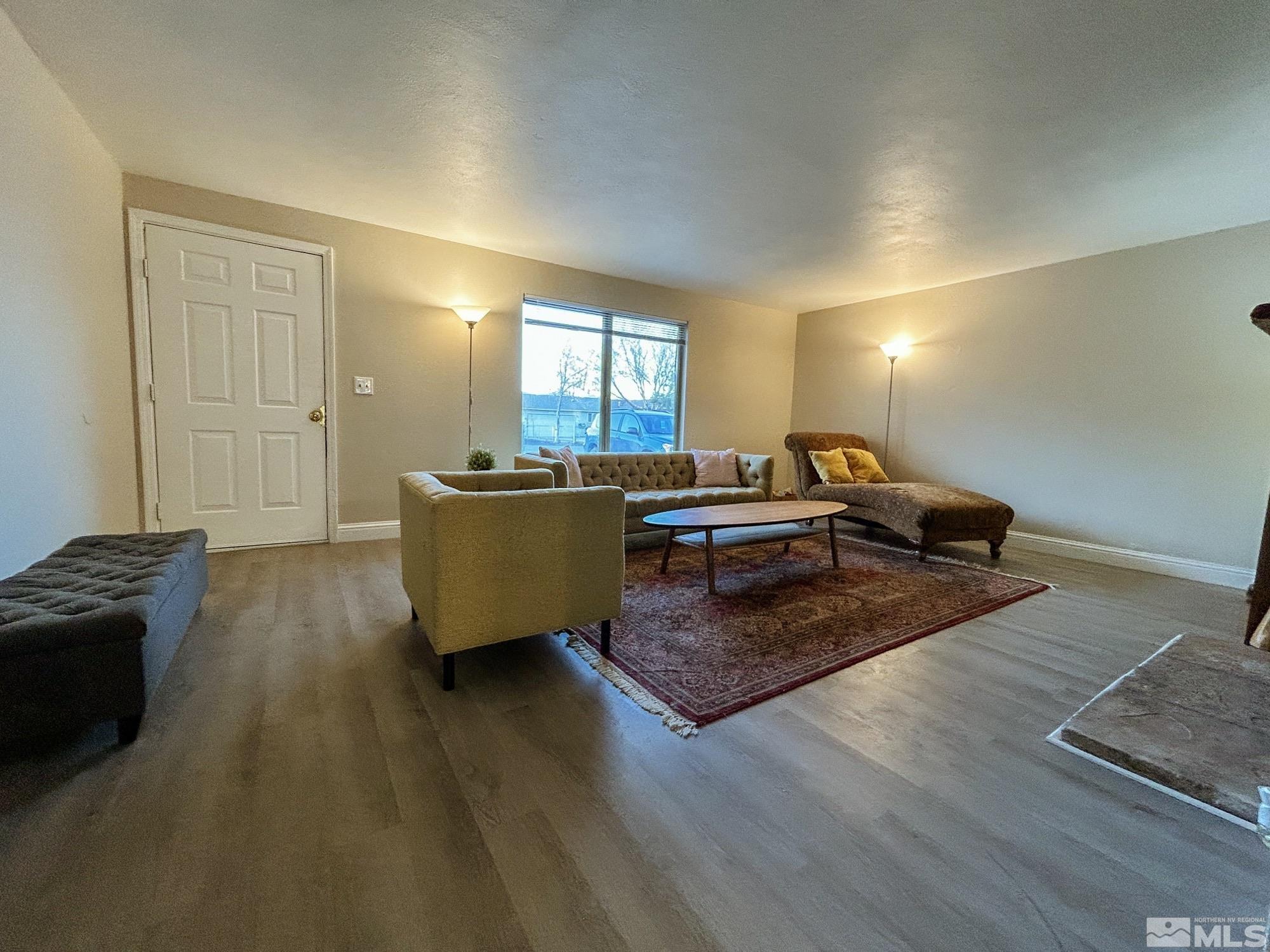130 Ring Road Dayton, NV 89403 - Photo 6 of 21 a living room with furniture and a wooden floor