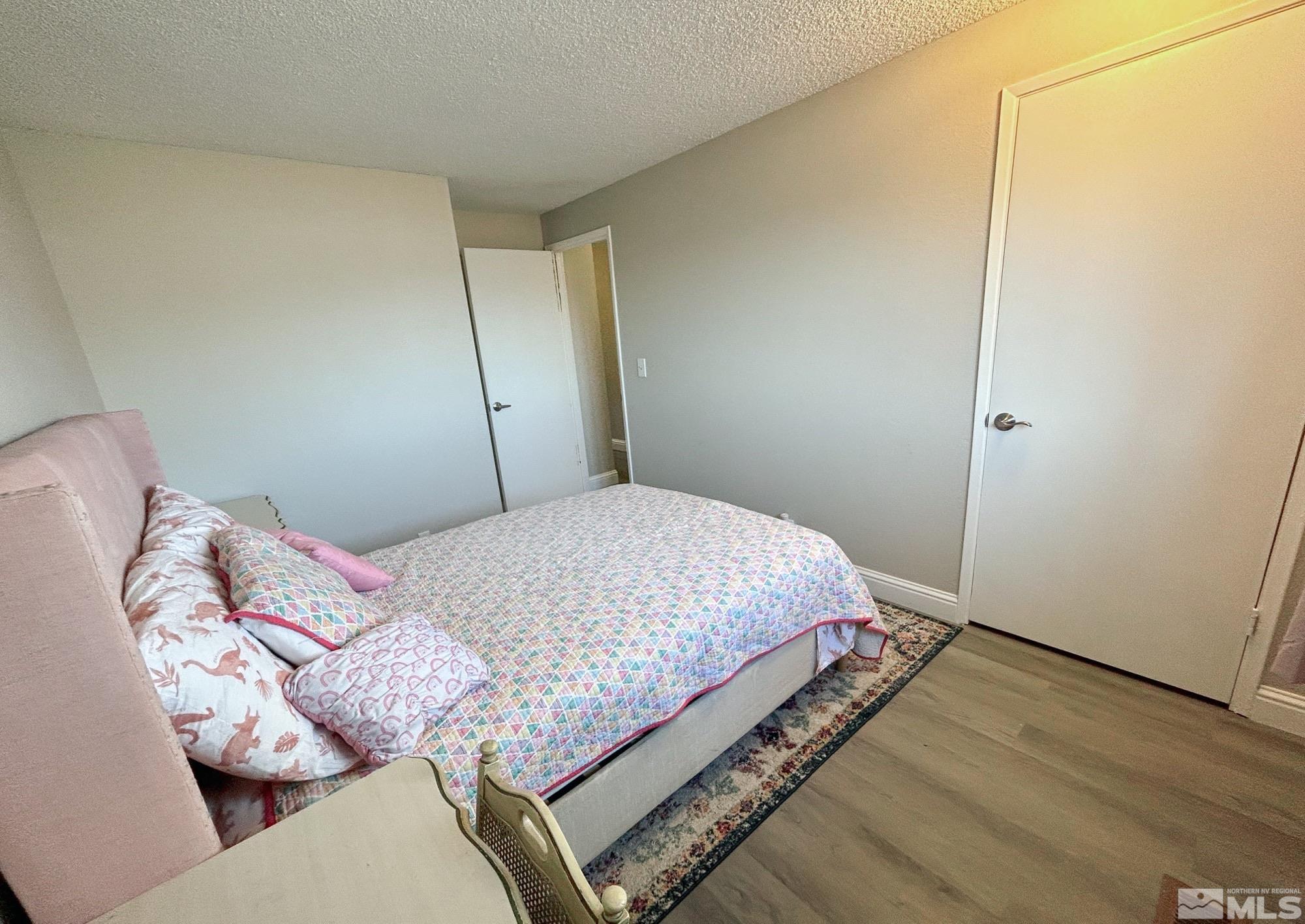 130 Ring Road Dayton, NV 89403 - Photo 10 of 21 a bedroom with a bed and a mirror