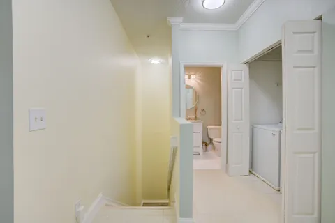 a view of a bathroom from a hallway