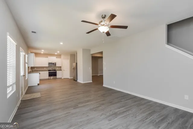 a kitchen with a refrigerator sink and microwave