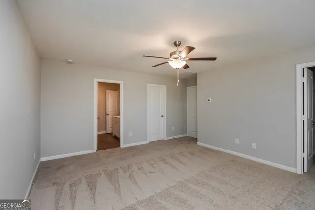 a view of an empty room and window