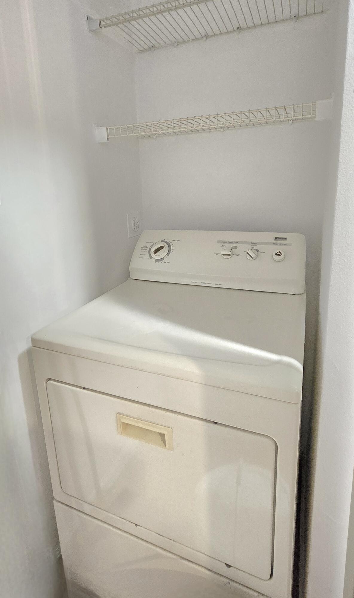 1000 Scotia Drive, Unit 106 Hypoluxo, FL 33462 - Photo 14 of 28 a close up view of washer and dryer