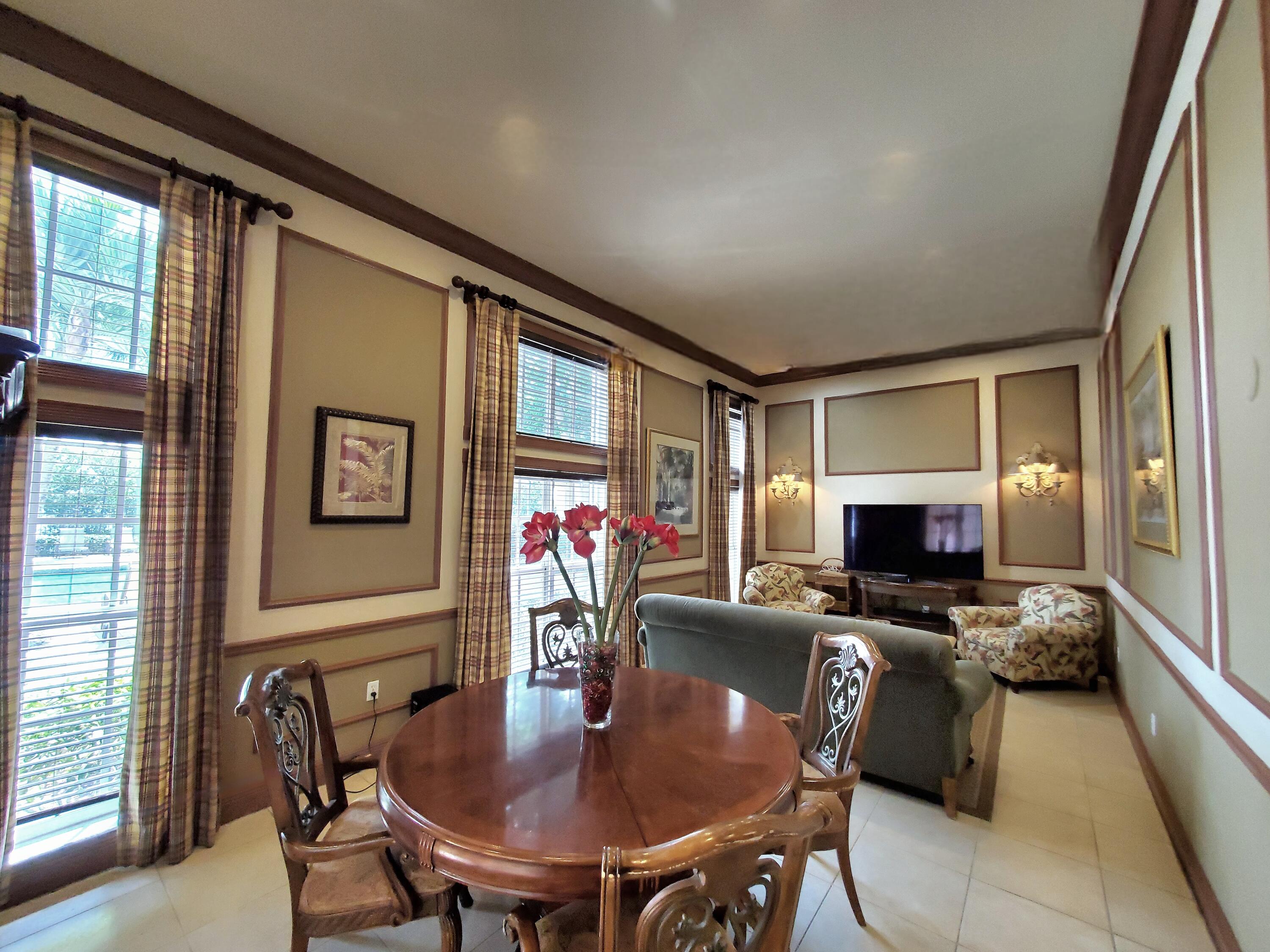 1000 Scotia Drive, Unit 106 Hypoluxo, FL 33462 - Photo 26 of 28 a workspace with furniture and window