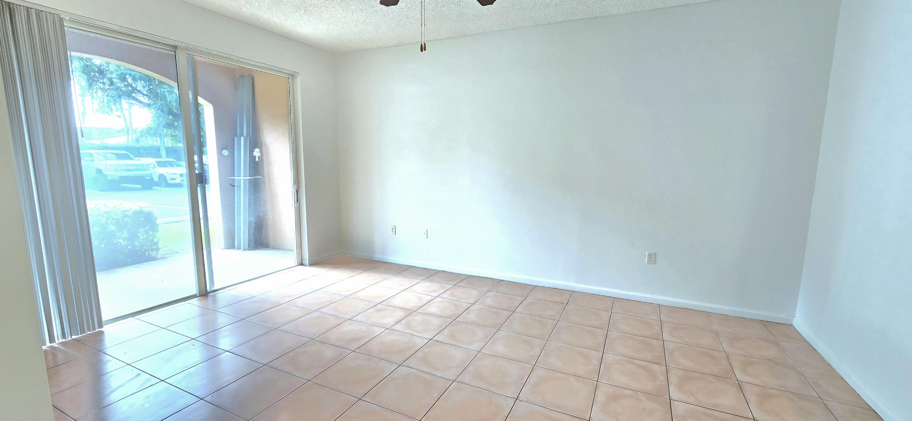 1000 Scotia Drive, Unit 106 Hypoluxo, FL 33462 - Photo 4 of 28 a view of an empty room and window
