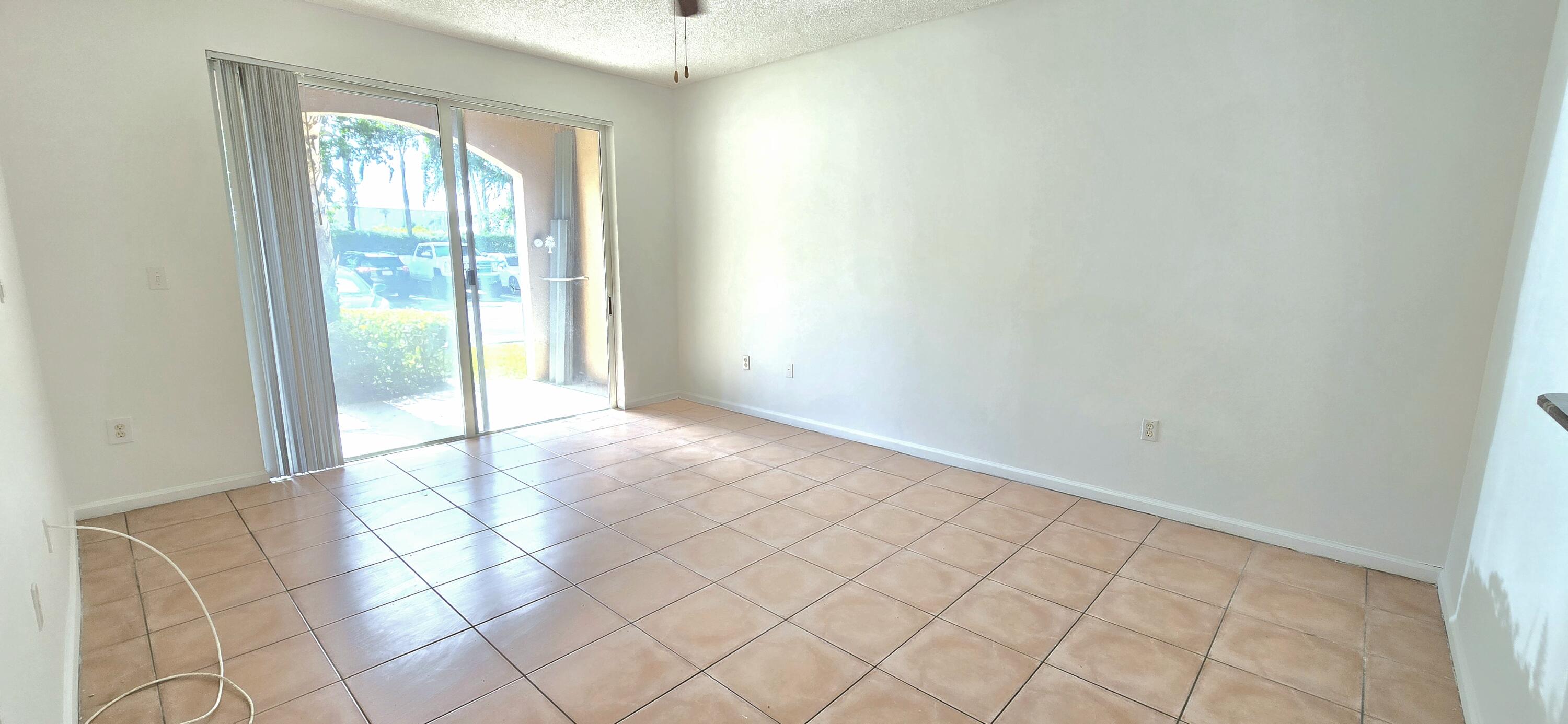 1000 Scotia Drive, Unit 106 Hypoluxo, FL 33462 - Photo 8 of 28 a view of an empty room and window