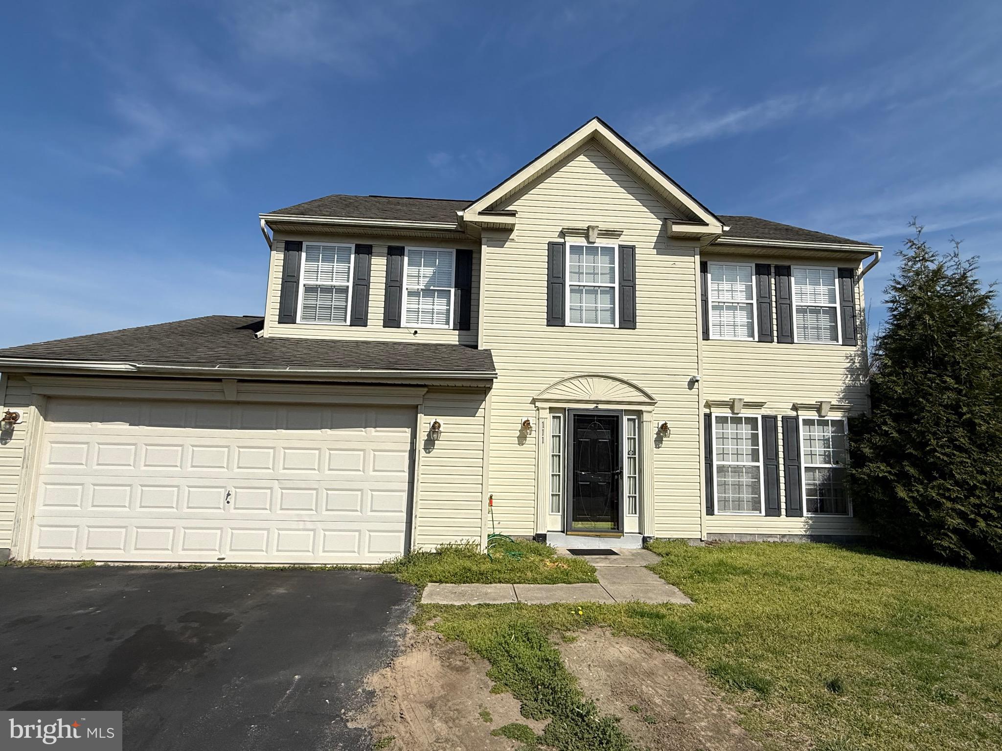 111 Martin Drive Hurlock, MD 21643 - Photo 1 of 27 a front view of a house with a garden
