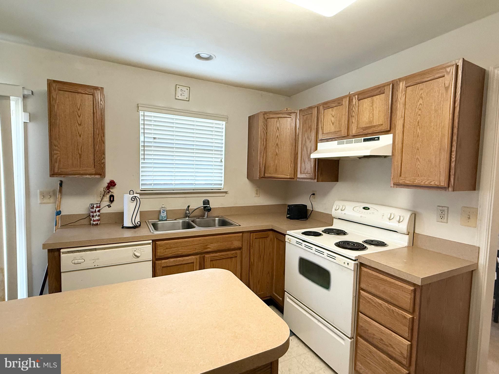 111 Martin Drive Hurlock, MD 21643 - Photo 12 of 27 a kitchen with appliances a sink and cabinets