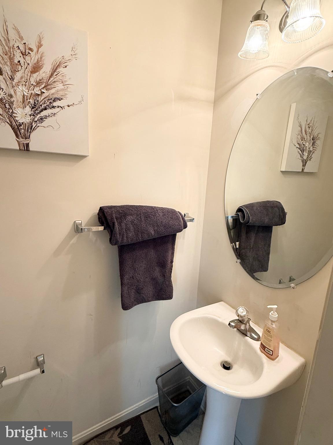 111 Martin Drive Hurlock, MD 21643 - Photo 16 of 27 a bathroom with a sink and a mirror
