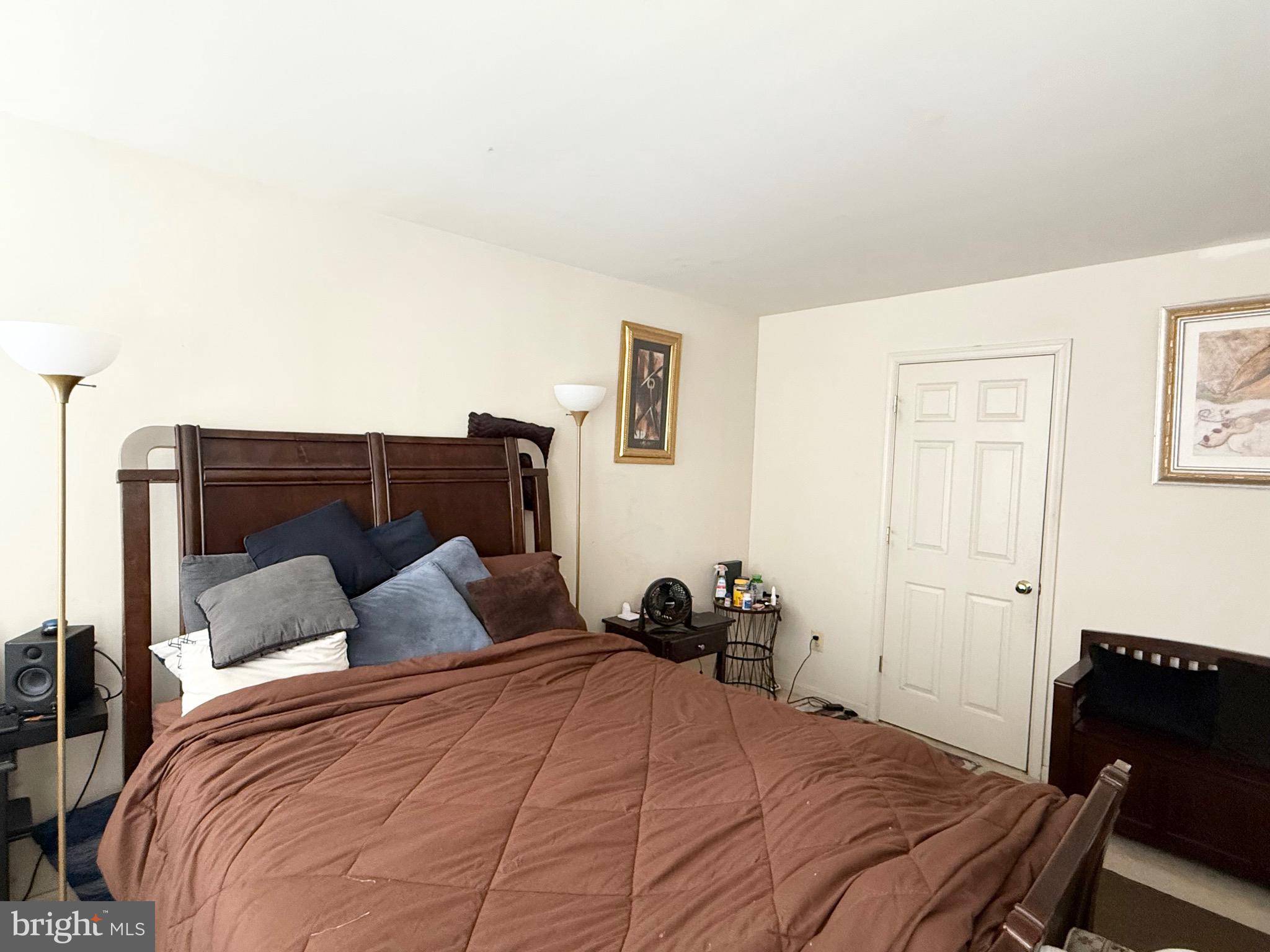 111 Martin Drive Hurlock, MD 21643 - Photo 18 of 27 a bedroom with a bed and wooden floor