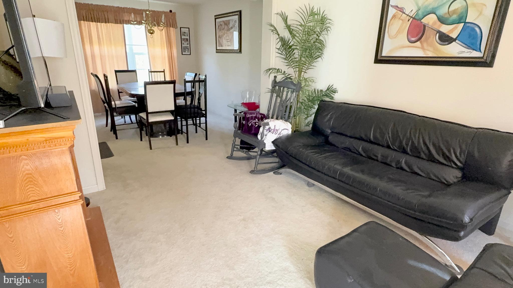 111 Martin Drive Hurlock, MD 21643 - Photo 8 of 27 a living room with furniture and a flat screen tv