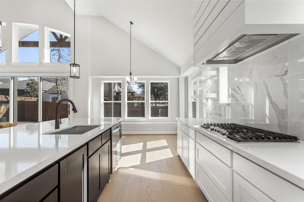 805 Veranda View McKinney, TX 75069 - Photo 14 of 40 a view of a kitchen with a sink and a large window