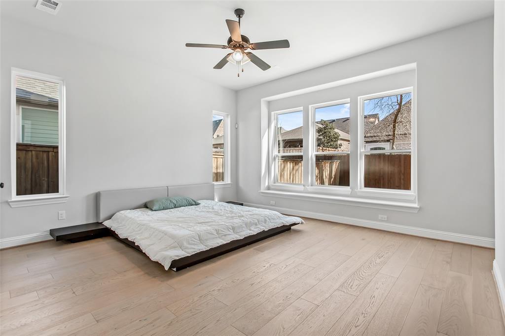 805 Veranda View McKinney, TX 75069 - Photo 19 of 40 a bedroom with a bed and a large window