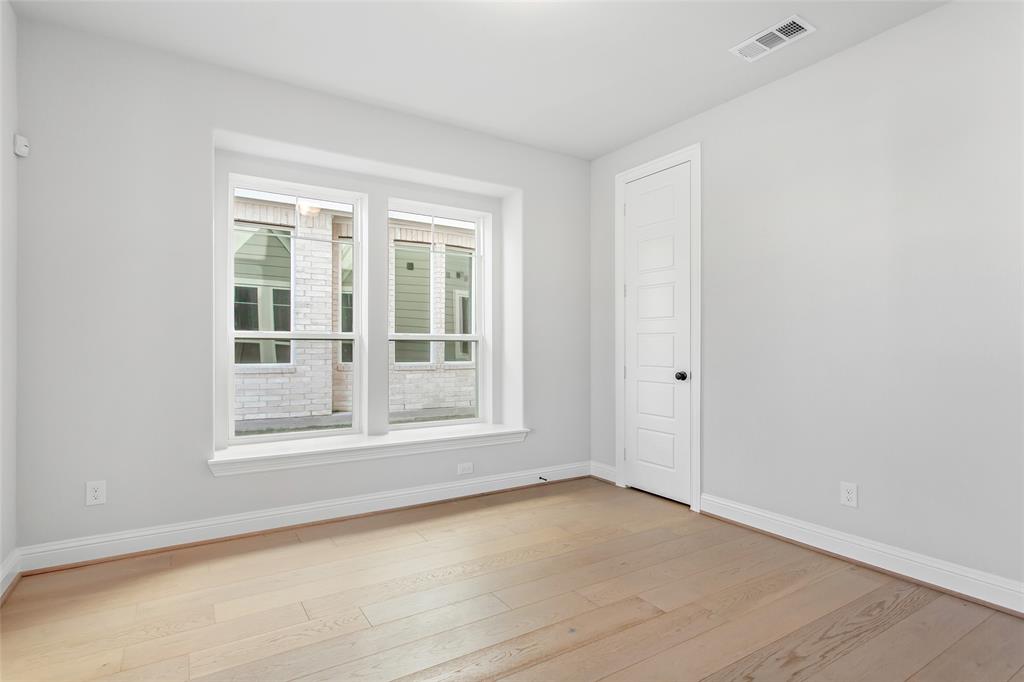 805 Veranda View McKinney, TX 75069 - Photo 22 of 40 a view of empty room with wooden floor and fan