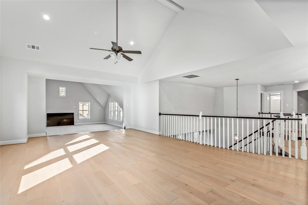 805 Veranda View McKinney, TX 75069 - Photo 26 of 40 a view of an empty room with a fireplace and a window