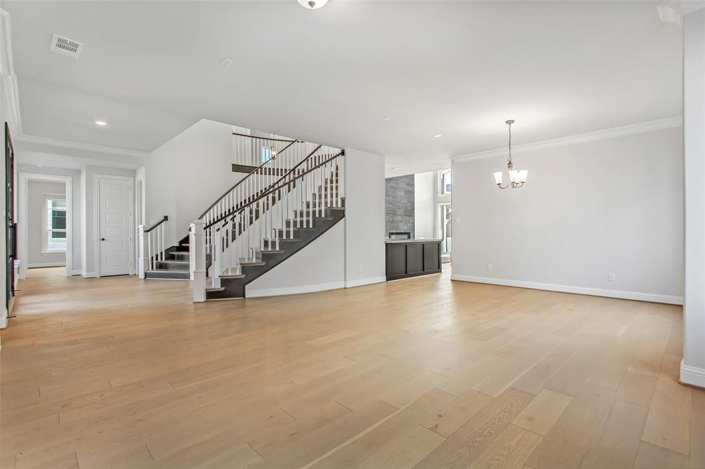 805 Veranda View McKinney, TX 75069 - Photo 8 of 40 a view of an empty room with stairs and a window