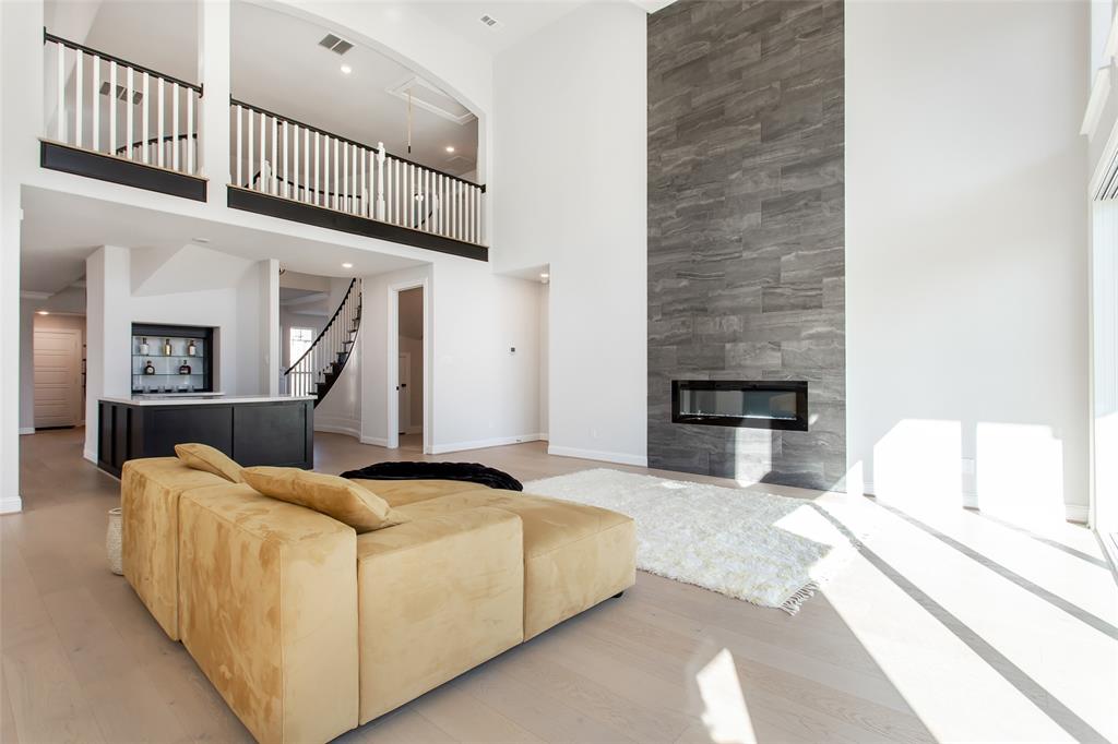 805 Veranda View McKinney, TX 75069 - Photo 10 of 40 a living room with furniture and a fireplace