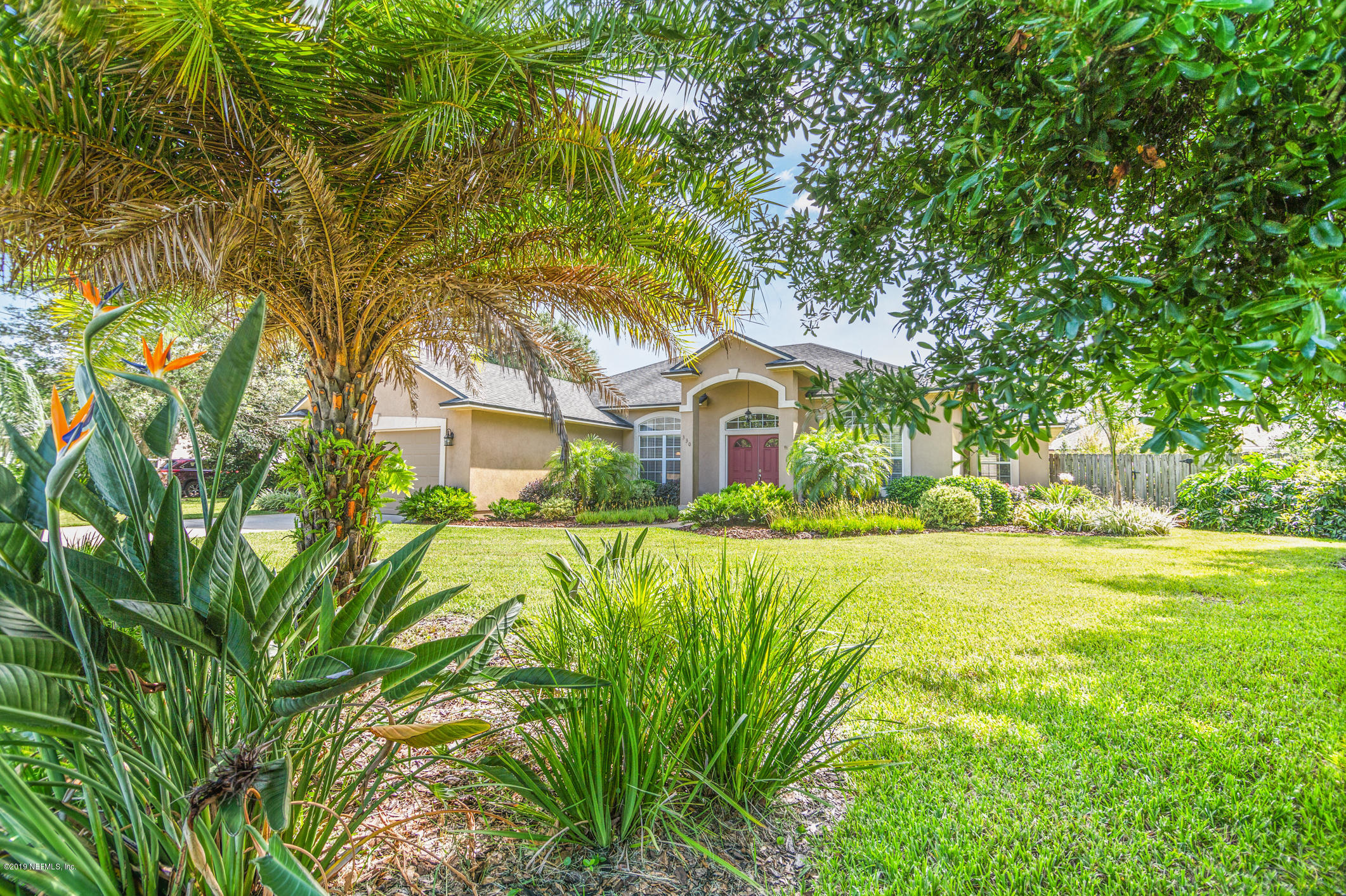 330 Orchis Road St. Augustine, FL 32086 - Photo 18 of 24 a front view of a house with yard and green space