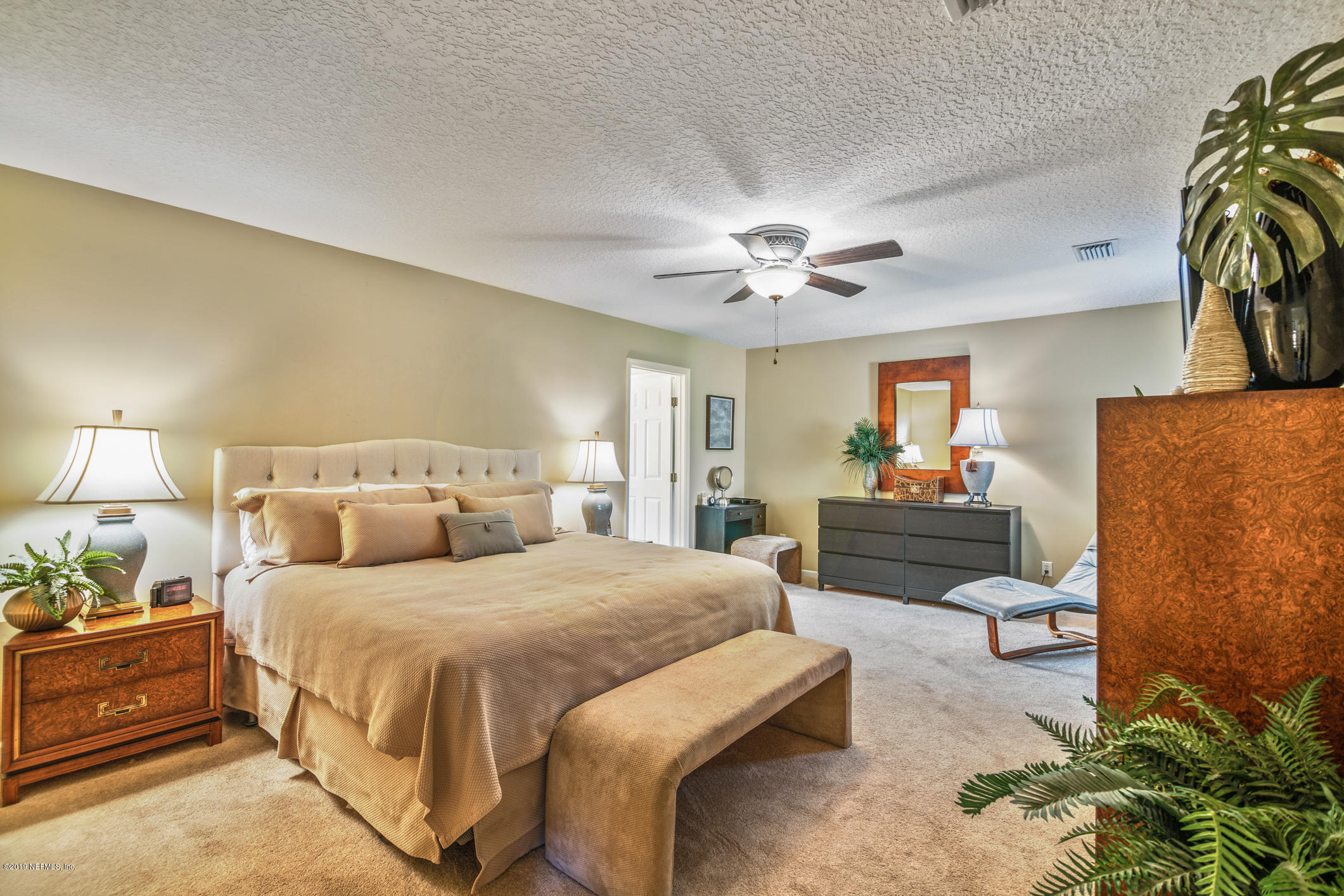 330 Orchis Road St. Augustine, FL 32086 - Photo 3 of 24 a bedroom with a bed and a couch
