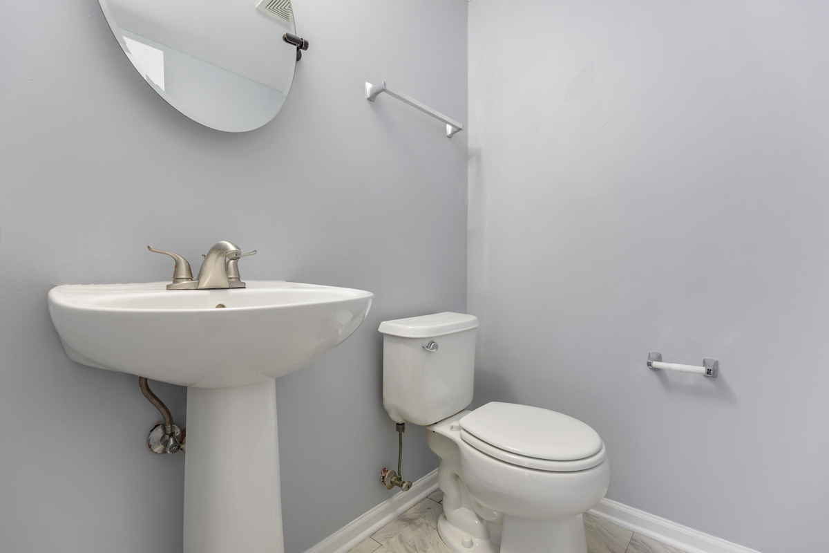 3185 Ketch Court Aurora, IL 60503 - Photo 14 of 25 a bathroom with a sink a toilet and mirror