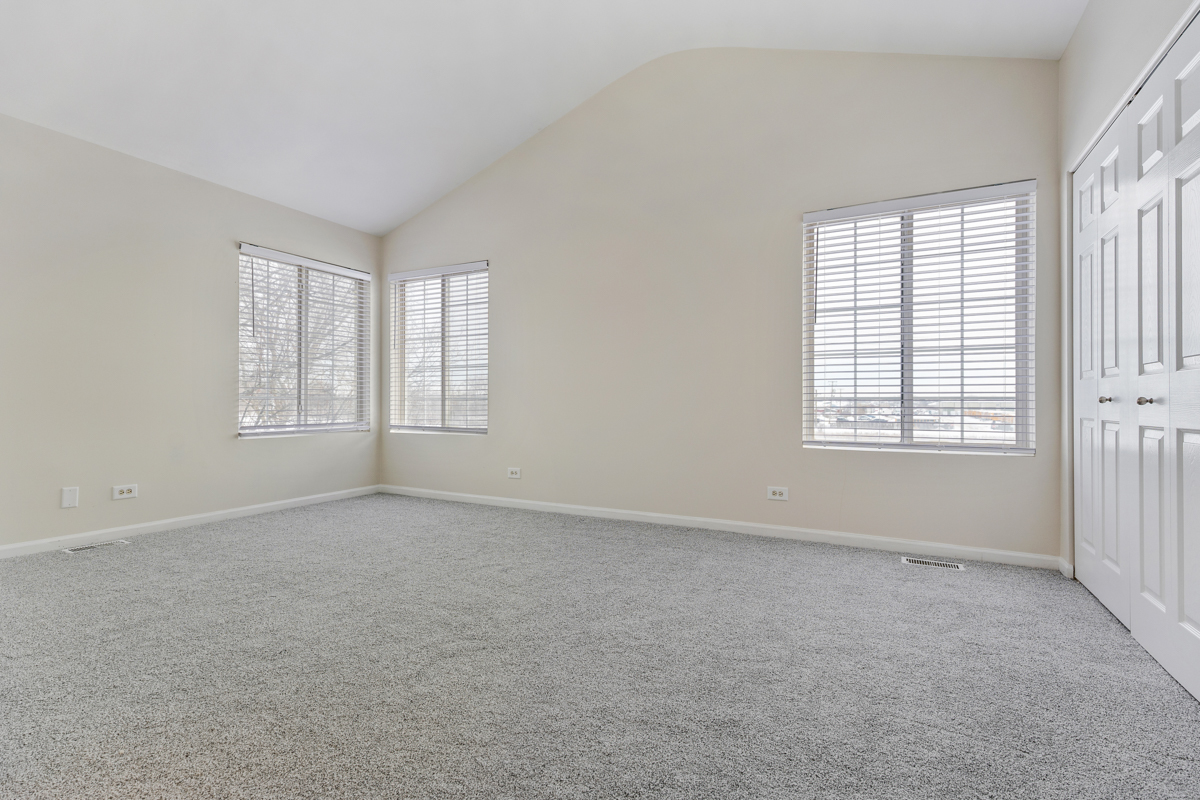 3185 Ketch Court Aurora, IL 60503 - Photo 16 of 25 an empty room with windows