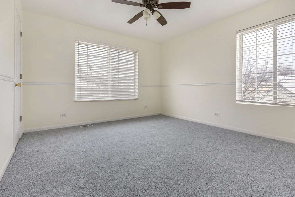 3185 Ketch Court Aurora, IL 60503 - Photo 19 of 25 a view of an empty room with a window
