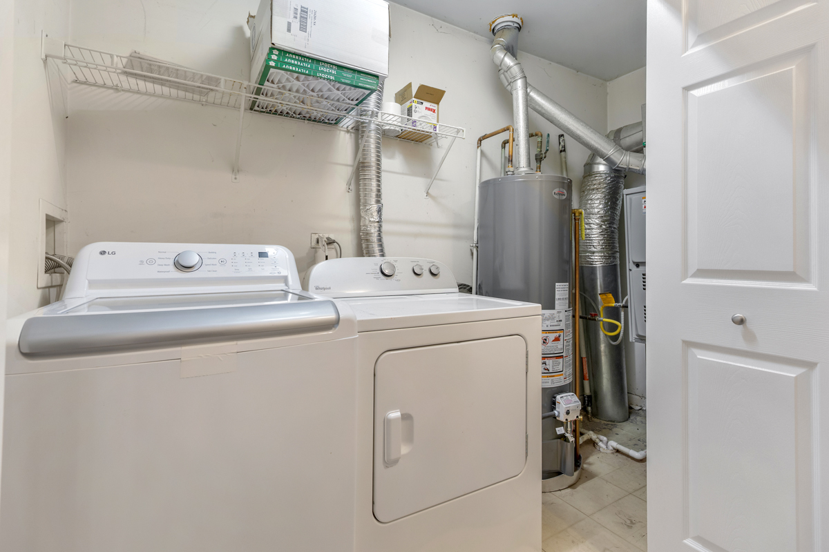 3185 Ketch Court Aurora, IL 60503 - Photo 21 of 25 a utility room with dryer and washer