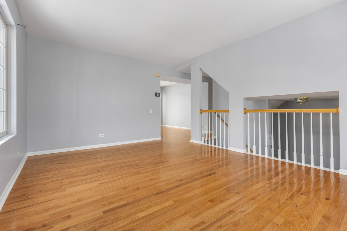 3185 Ketch Court Aurora, IL 60503 - Photo 6 of 25 a view of a hallway with wooden floor